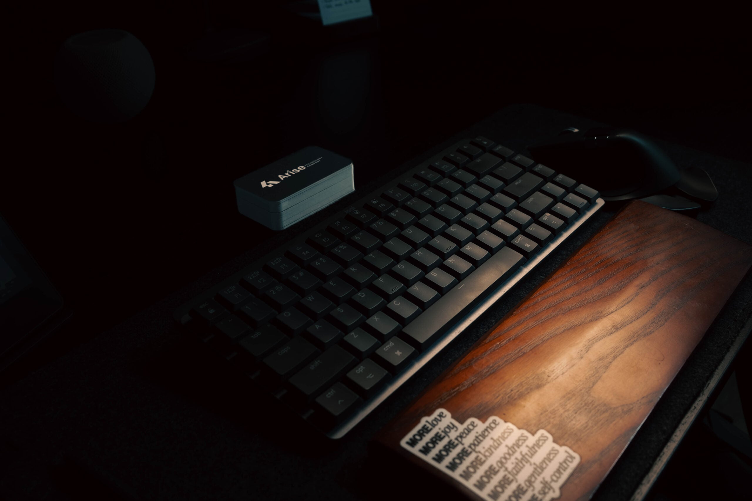 Keyboard and desk details in the Arise workspace.