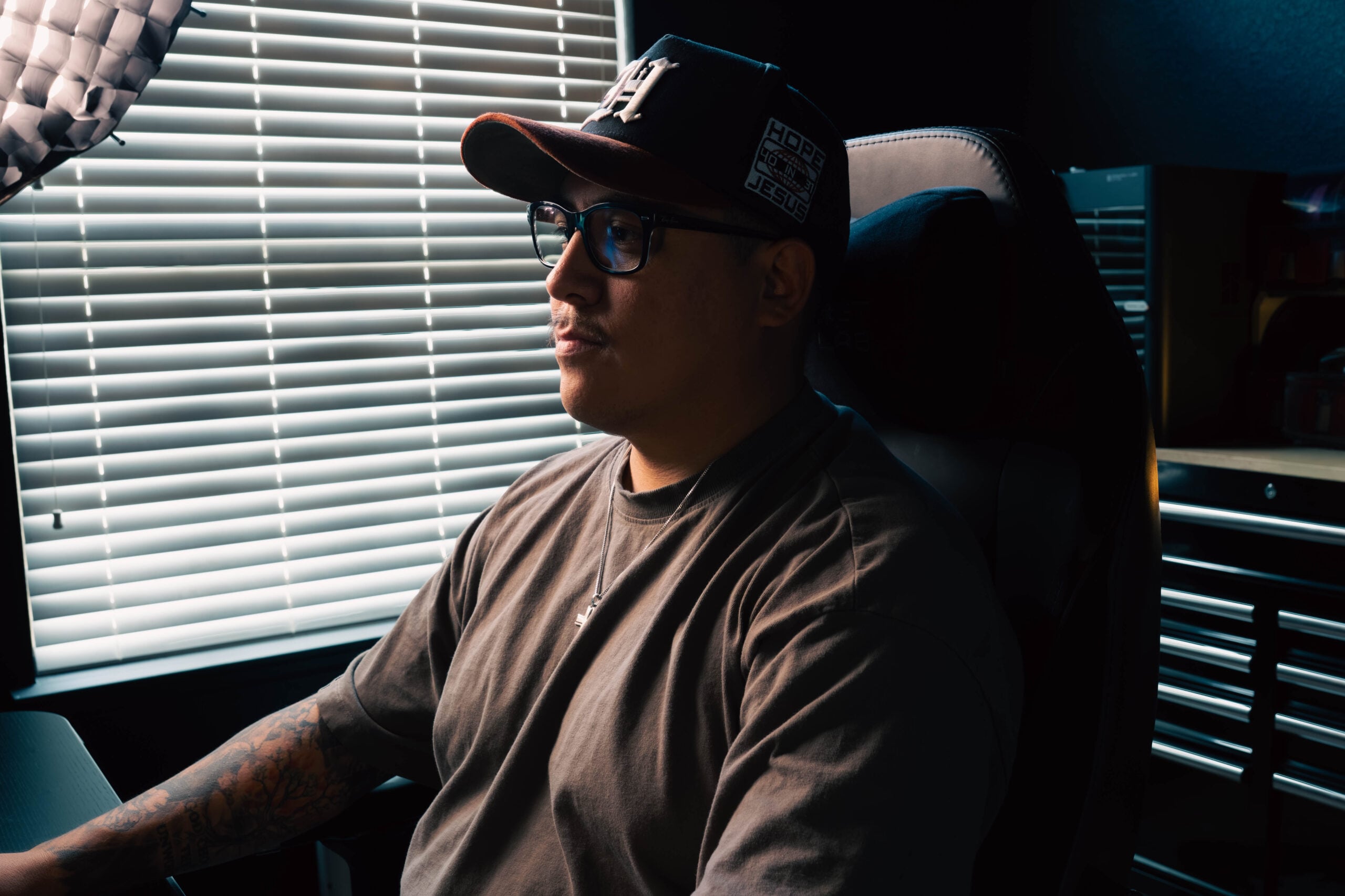 Saul Ibarra seated at his workspace.